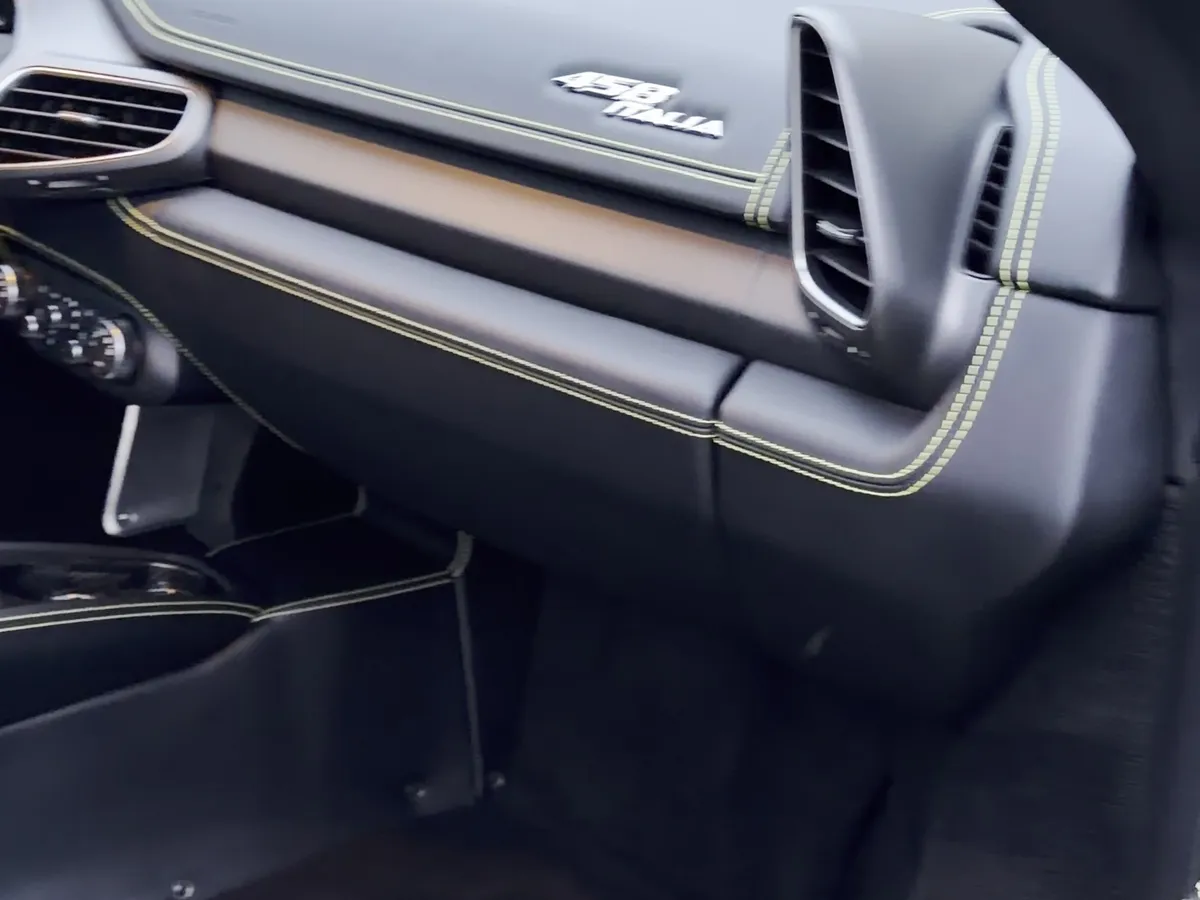 Same Ferrari 458 footwell after a full interior detail — immaculate